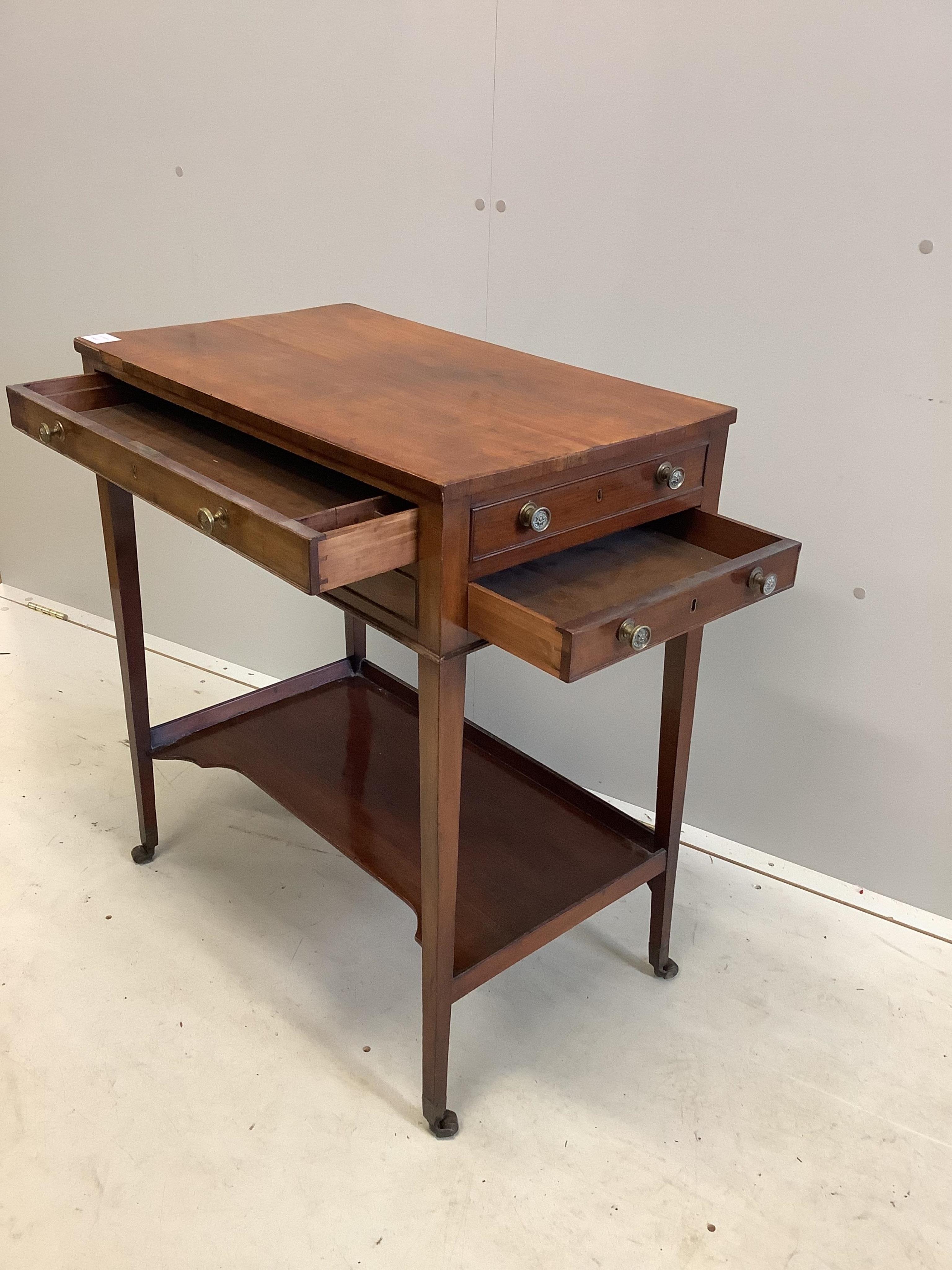 A George III mahogany two drawer side table, fitted with an undertier, width 67cm, depth 40cm, height 76cm. Condition - fair